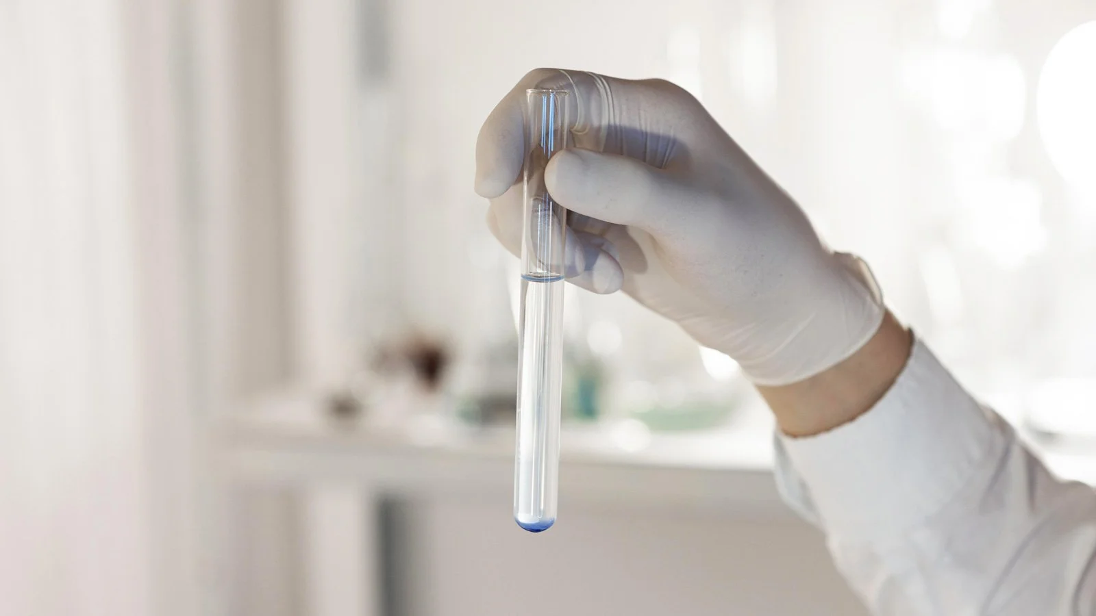 Close-up hand holding pipette